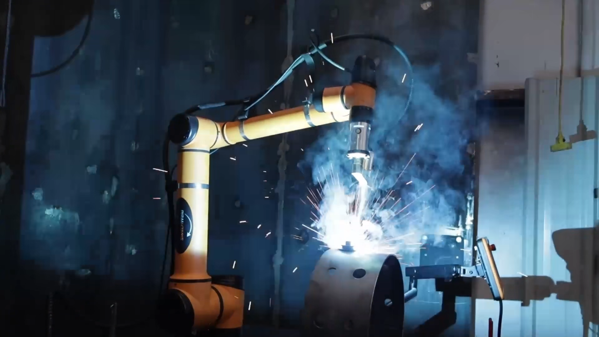 AUBO collaborative robot performing automated precision arc welding and metal cutting on heavy workpieces
